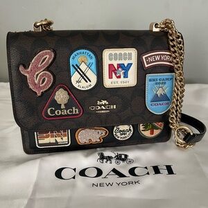 Coach Klare Crossbody Bag
In Signature Canvas With Ski Patches